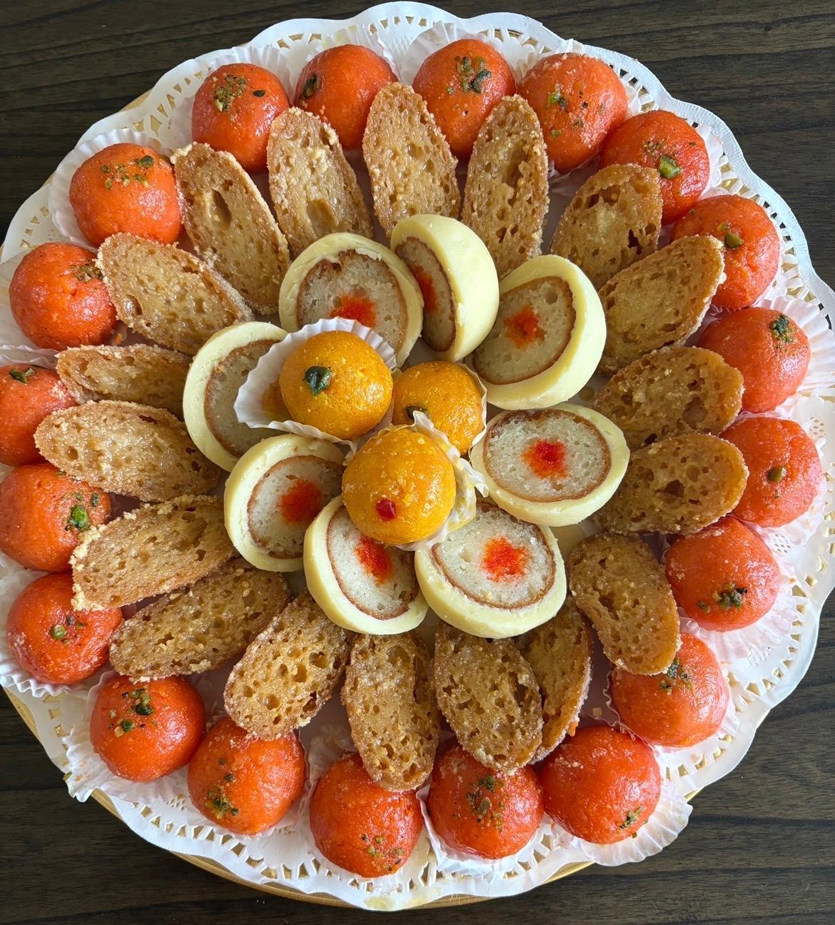 Bondia and kheer toast platter with laddu centerpiece