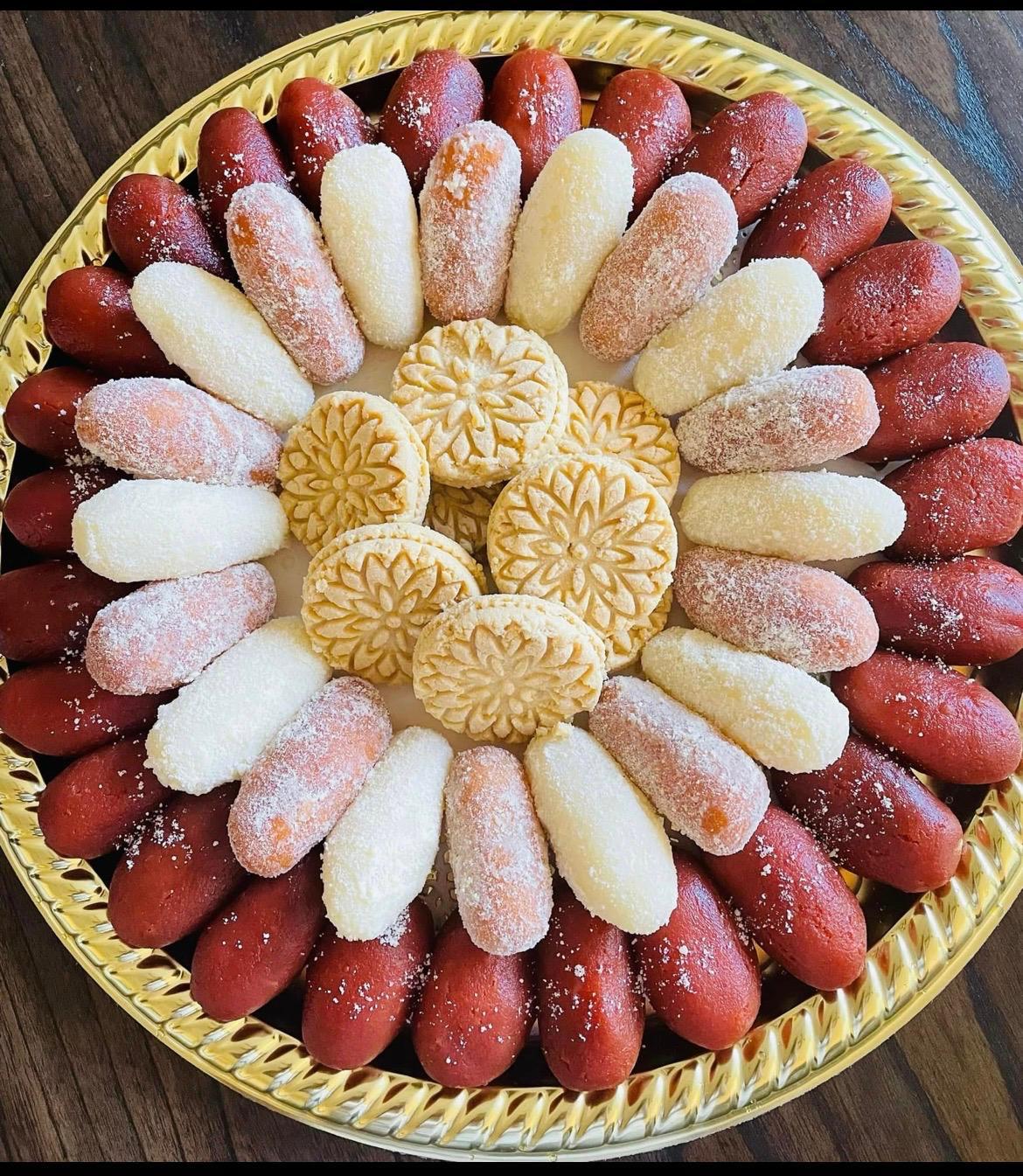 Red and white chum chum platter with embossed sandesh center
