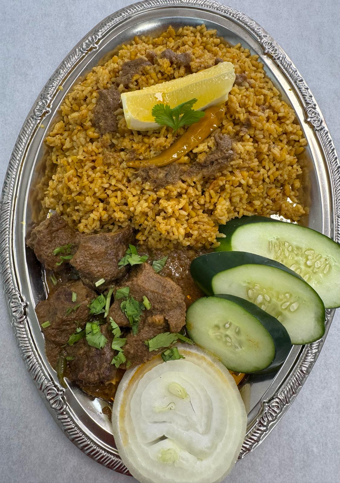 Full tray of Bengali kechuri served with tender beef curry
