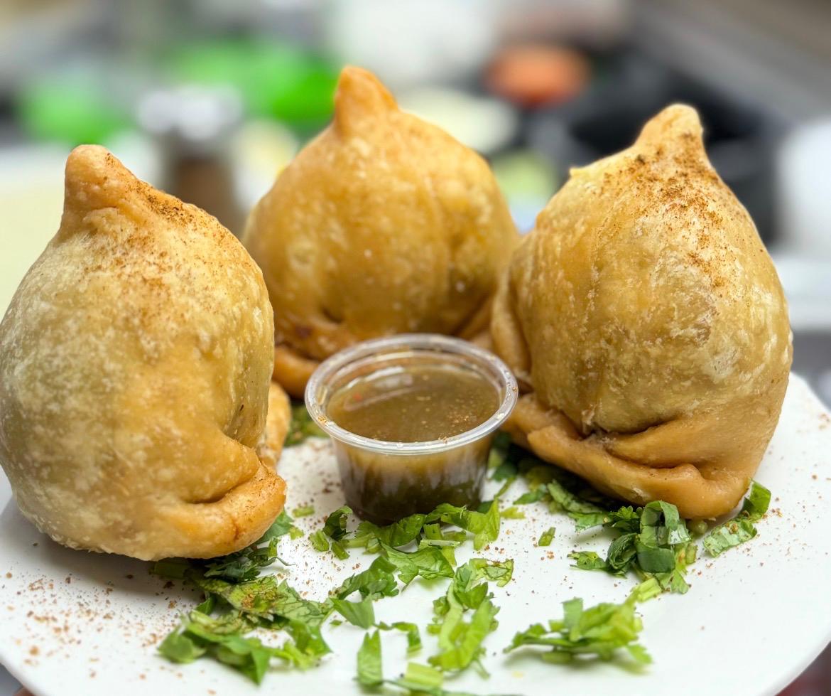 Stack of crispy beef singara samosas